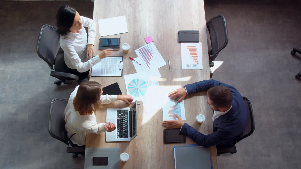 Colleagues reviewing records at a table