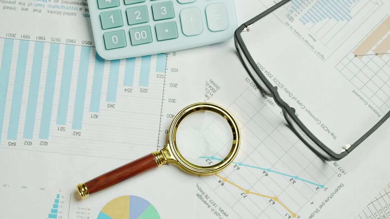A magnifying glass over documents